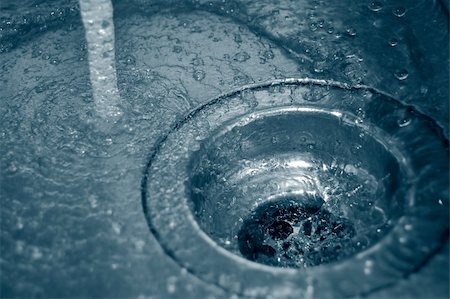 sink with bath bubbles - water flow into the drain in the kitchen Stock Photo - Budget Royalty-Free & Subscription, Code: 400-04817937