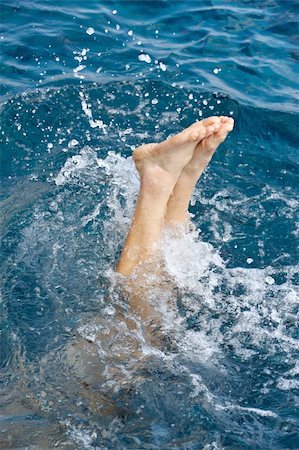 pool man feet - Young man jumping into water Stock Photo - Budget Royalty-Free & Subscription, Code: 400-04818015