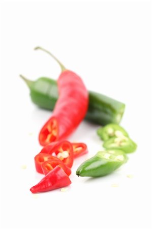 simsearch:600-05973313,k - Red and green chili pepper isolated on white background. Shallow dof Photographie de stock - Aubaine LD & Abonnement, Code: 400-04818349