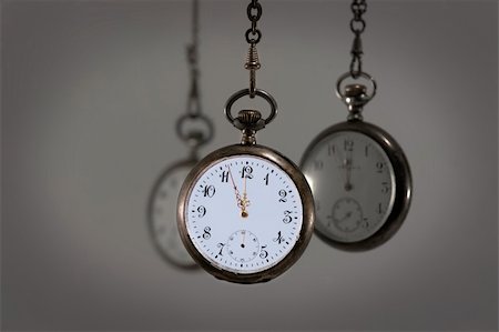 pocket watch - Three vintage pocket watches with gray background Stock Photo - Budget Royalty-Free & Subscription, Code: 400-04818387