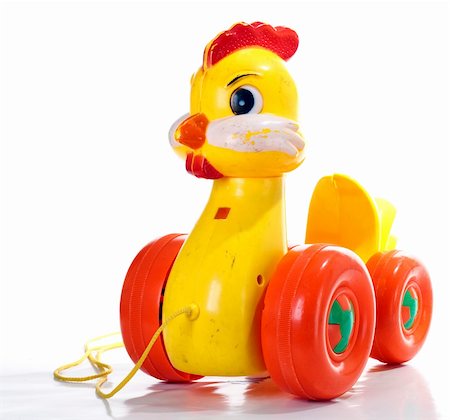 plastic toy family - Old duck toy, after a lot of playing, dirty & broken, isolated on white background Stock Photo - Budget Royalty-Free & Subscription, Code: 400-04818968