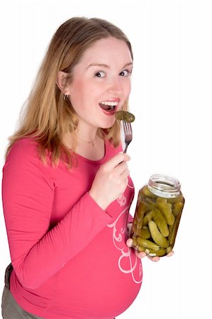 funny wellness healthcare - Happy pregnant woman tasting pickle isolated on white Stock Photo - Budget Royalty-Free & Subscription, Code: 400-04819053