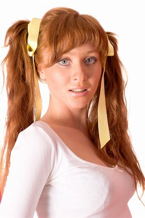 Redhead woman wearing ponytails isolated on white Stockbilder - Microstock & Abonnement, Bildnummer: 400-04819082