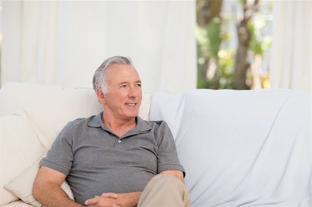 Senior sitting  in his sofa Stock Photo - Budget Royalty-Free & Subscription, Code: 400-04819584