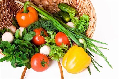 simsearch:400-04785187,k - Basket with vegetables isolated on white background. Photographie de stock - Aubaine LD & Abonnement, Code: 400-04810347