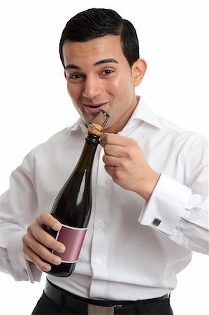 simsearch:400-04765778,k - Happy man or waiter opening a bottle of alcohol, wine or champagne for a celebration or special occasion. Stock Photo - Budget Royalty-Free & Subscription, Code: 400-04810597