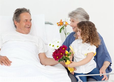 A little girl talking with her grandparents in a hospital Stock Photo - Budget Royalty-Free & Subscription, Code: 400-04810671