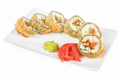 simsearch:689-03123940,k - Sushi rolls at plate isolated on a white Photographie de stock - Aubaine LD & Abonnement, Code: 400-04811248