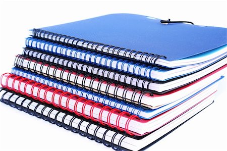 simsearch:700-00185645,k - Stack of colorful copybooks isolated on white background. Photographie de stock - Aubaine LD & Abonnement, Code: 400-04811829