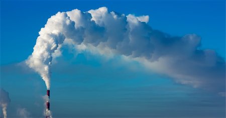 Smoking towers against the clear blue sky. Fotografie stock - Microstock e Abbonamento, Codice: 400-04812172