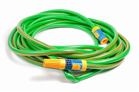 simsearch:400-06175559,k - Green and yellow garden water hose with yellow sprinkler isolated on white background Stock Photo - Budget Royalty-Free & Subscription, Code: 400-04812263