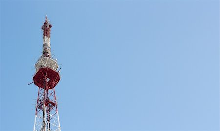 Telecommunication tower over blue cloudless sky. Horizontal. Fotografie stock - Microstock e Abbonamento, Codice: 400-04812284