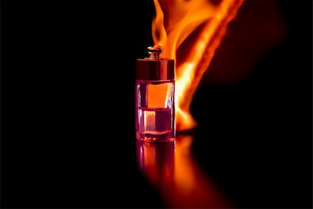 simsearch:700-06892568,k - Bottle of perfume, burning in flames and darkness. Stock Photo - Budget Royalty-Free & Subscription, Code: 400-04812690