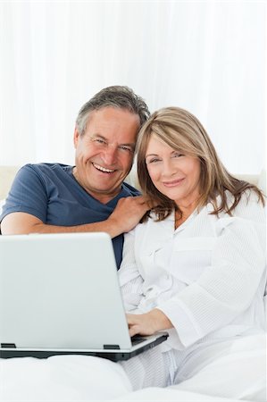 Couple looking at the camera at home Stock Photo - Budget Royalty-Free & Subscription, Code: 400-04813090