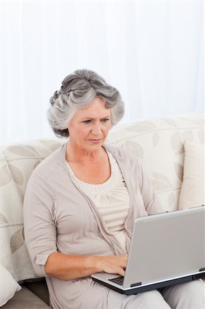 Woman working on her laptop at home Stock Photo - Budget Royalty-Free & Subscription, Code: 400-04813115
