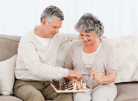 simsearch:400-04311095,k - Couple playing chess on their sofa at home Stock Photo - Budget Royalty-Free & Subscription, Code: 400-04813132