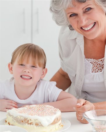 simsearch:400-04813285,k - Lovely girl and her grandmother looking at the camera Stock Photo - Budget Royalty-Free & Subscription, Code: 400-04813285