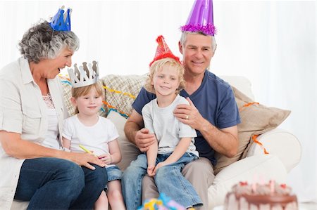parents and grandparents birthday party - Happy family looking at the camera on a birthday Stock Photo - Budget Royalty-Free & Subscription, Code: 400-04813298