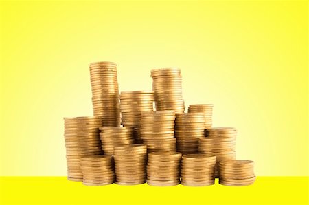 simsearch:400-07574972,k - Coins on yellow background Stock Photo - Budget Royalty-Free & Subscription, Code: 400-04813330