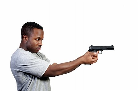 police investigator at work - A black African American police detective man on the job with a gun Stock Photo - Budget Royalty-Free & Subscription, Code: 400-04813641