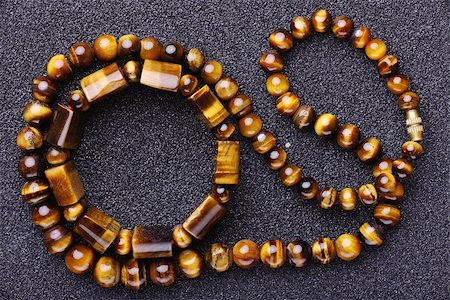 fotomod (artist) - Bracelet and a necklace of tiger eye . Background. Texture. Stock Photo - Budget Royalty-Free & Subscription, Code: 400-04813918