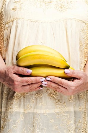 fuzzbones (artist) - Housewife holding bunch of bananas Stock Photo - Budget Royalty-Free & Subscription, Code: 400-04813973