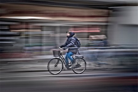 Bicycle woman rushing on the street in motion blur, side view  from Copenhagen, Denmark. Stock Photo - Budget Royalty-Free & Subscription, Code: 400-04824192