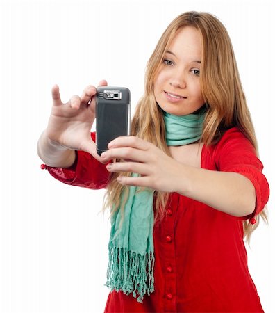beautiful smiling teenage girl taking photo with her mobile phone. Isolated on white background Fotografie stock - Microstock e Abbonamento, Codice: 400-04824241