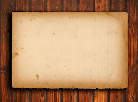 scrolled up paper - old paper on brown wood texture with natural patterns Stock Photo - Budget Royalty-Free & Subscription, Code: 400-04824300