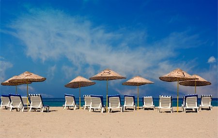 Sun loungers on a deserted beach Stock Photo - Budget Royalty-Free & Subscription, Code: 400-04824352