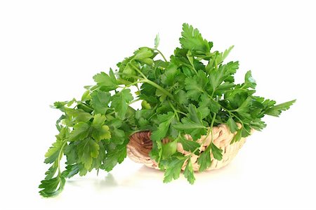 petroselinum crispum - a bunch of parsley in a basket on a white background Stock Photo - Budget Royalty-Free & Subscription, Code: 400-04824636