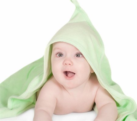 Cute smiling baby with a green towel on a white Foto de stock - Super Valor sin royalties y Suscripción, Código: 400-04824854