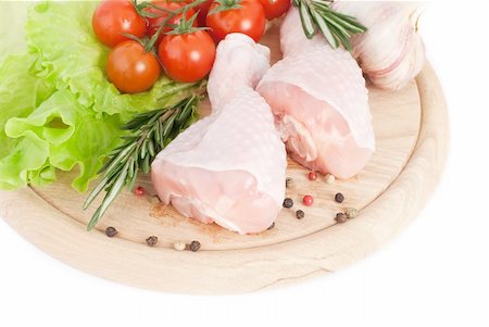 raw chicken on cutting board - Chicken drumsticks with vegetables on the cutting board Stock Photo - Budget Royalty-Free & Subscription, Code: 400-04824853
