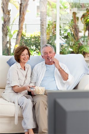 simsearch:400-04311095,k - Seniors watching tv at home Stock Photo - Budget Royalty-Free & Subscription, Code: 400-04825012