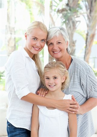 Portrait of a joyful family looking at the camera at home Stock Photo - Budget Royalty-Free & Subscription, Code: 400-04825032