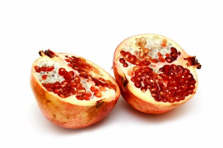 simsearch:693-08127360,k - fresh and tasty pomegranate isolated on white Photographie de stock - Aubaine LD & Abonnement, Code: 400-04825087