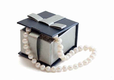 string of pearls for wedding - A string of pearls in a box on white background Stock Photo - Budget Royalty-Free & Subscription, Code: 400-04825341
