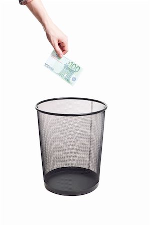 paper trash can throw - hand gold euro to trash can isolated Stock Photo - Budget Royalty-Free & Subscription, Code: 400-04825362