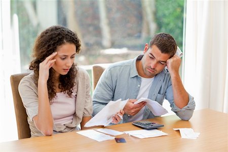 Young couple calculating their domestic bills at home Stock Photo - Budget Royalty-Free & Subscription, Code: 400-04825587