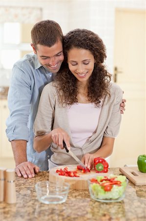 simsearch:400-04853599,k - Handsome man cooking with his girlfriend at home Foto de stock - Royalty-Free Super Valor e Assinatura, Número: 400-04829095