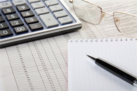 Calculator, notebook and pen lie on the business newspaper Stock Photo - Budget Royalty-Free & Subscription, Code: 400-04829531