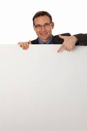 employee hold a sign - young businessman behind a blank sign Stock Photo - Budget Royalty-Free & Subscription, Code: 400-04829650