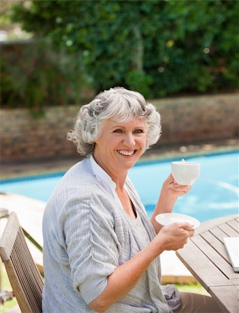 swimming grandparent - Senior woman drinking coffee Stock Photo - Budget Royalty-Free & Subscription, Code: 400-04829820