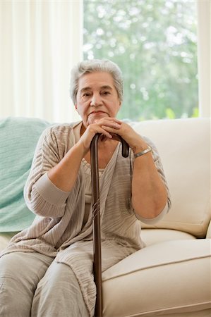 shoulder rides - Senior woman with her walking stick Photographie de stock - Aubaine LD & Abonnement, Code: 400-04829832