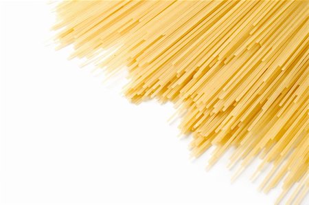 uncooked spaghetti close-up on a white background Stockbilder - Microstock & Abonnement, Bildnummer: 400-04820120