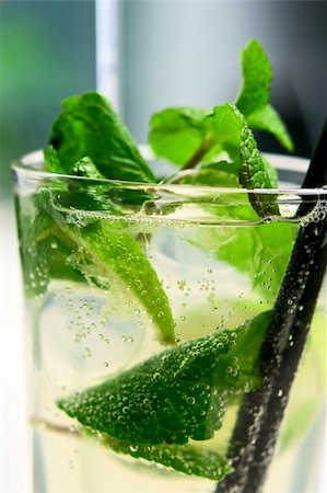 simsearch:400-04281837,k - Glass of mojito cocktail covered with air bubbles. Closeup. Small depth of field Stock Photo - Budget Royalty-Free & Subscription, Code: 400-04820161