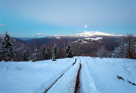 dirt road with sunset - Winter night mountain dirty road, forest with last autumn foliage and Moon on twilight sky (Petros and Goverla Mountain, Carpathian, Ukraine) Stock Photo - Budget Royalty-Free & Subscription, Code: 400-04820244