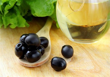 simsearch:400-05666507,k - black olives and a bottle of olive oil on a wooden table Stock Photo - Budget Royalty-Free & Subscription, Code: 400-04820360