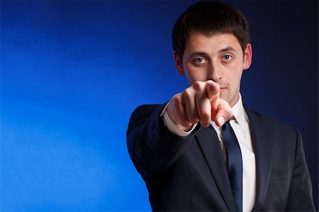 eye pointing - Young man pointing. Stock Photo - Budget Royalty-Free & Subscription, Code: 400-04821398
