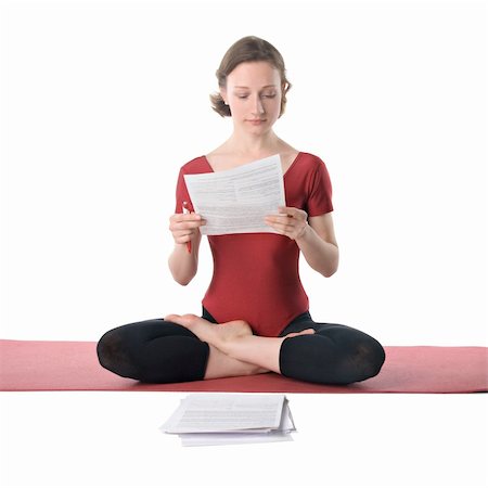 reading while stretching - Young woman in sports clothes working with documents Stock Photo - Budget Royalty-Free & Subscription, Code: 400-04822053
